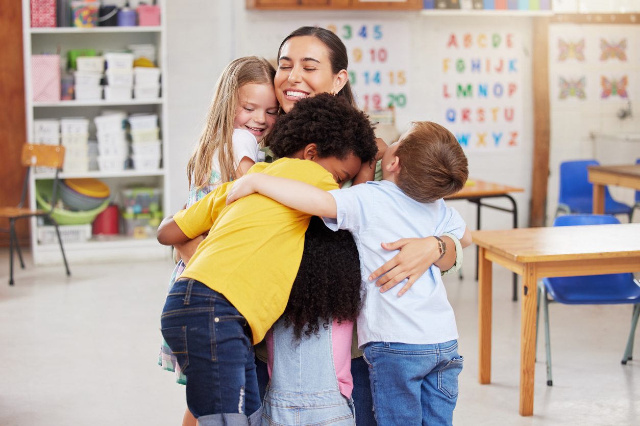 Shot of a woman hugging her learners